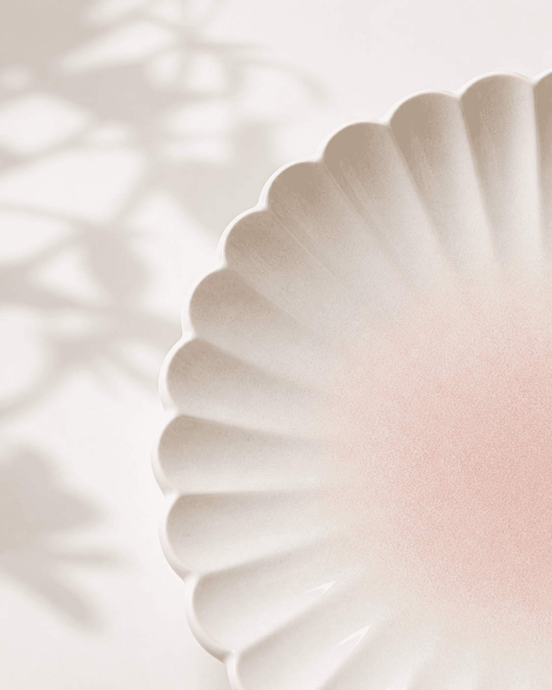 Abstract sage white ceramic plate closeup